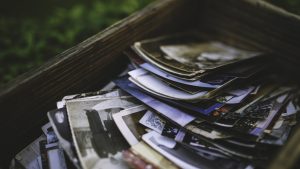 Wooden box with vintage photos and postcards.